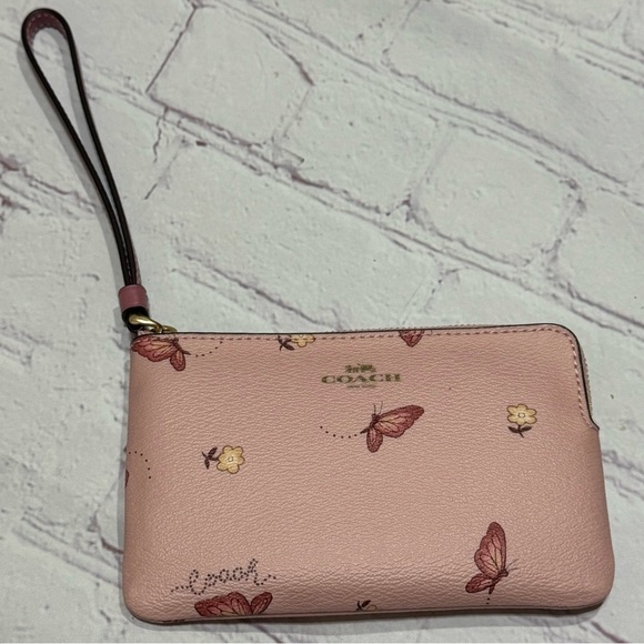 Coach Handbags - COACH Corner Zip Wristlet In Pink Signature Canvas With ButterFly Print nwt